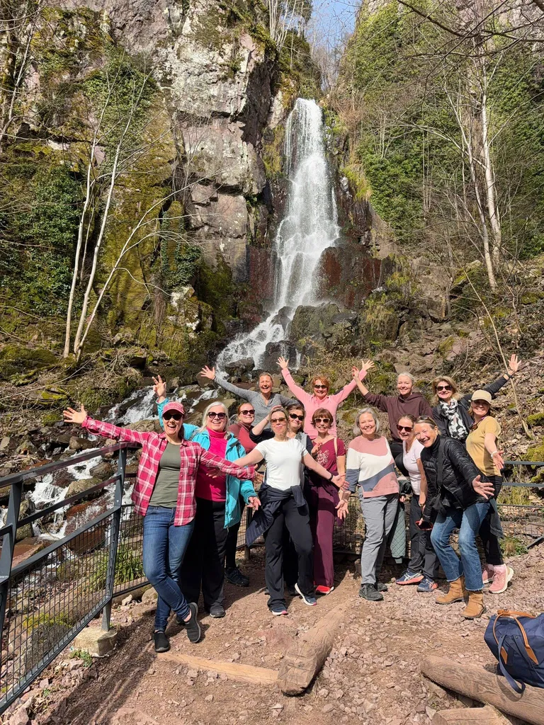 Group of visitors exploring Alsace and the Nideck waterfall